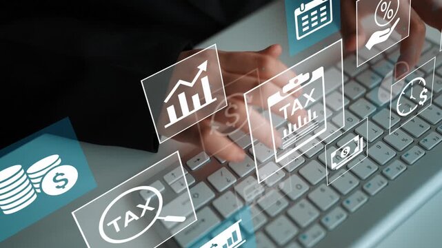 Business Professional Analyzing Financial Data with Digital Tax Icons and Graphs Displayed on Keyboard. Entropy.