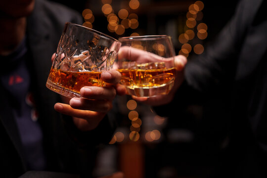 Toasting with Whiskey in a Celebration Night
