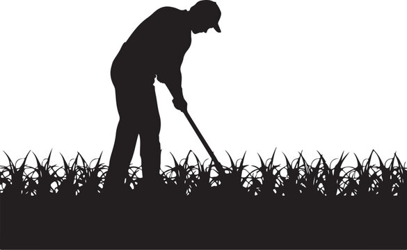Silhouette of a man hoeing a field of crops farmer gardening