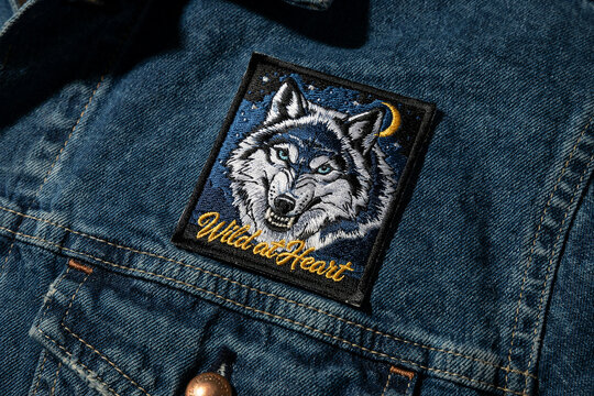 Wolf patch, denim jacket, Wild at Heart, embroidered design, blue jeans