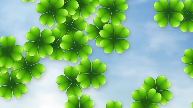 Green Four Leaf Clovers Falling Against a Bright Cloudy Blue Sky
