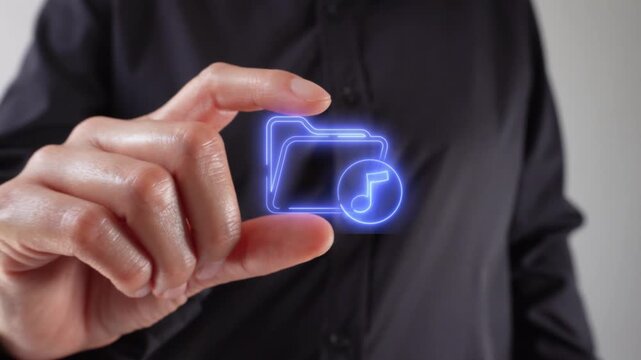 Close-up of a woman's hands holding a folder with a musical note between her two fingers