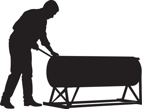 Silhouette of man rolling a barrel on a stand with a tool