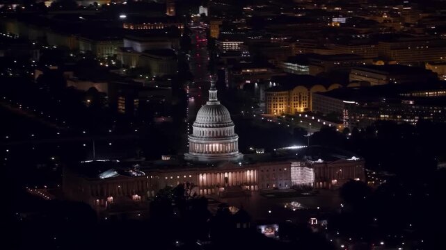 Illuminated United States Capitol Building at Night Aerial View in Washington DC
