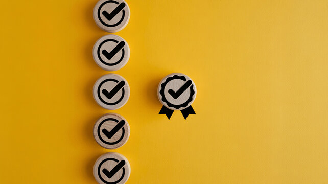 Vertical arrangement of wooden checkmark tokens and quality seal on a bright yellow textured background with white space with circular tokens checkmarks