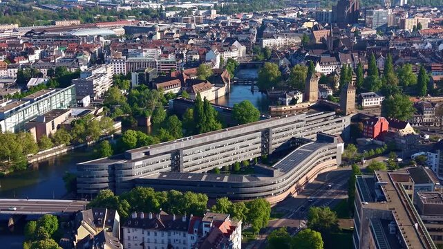 H&ocirc;tel d'Alsace, now Collectivit&eacute; europ&eacute;enne d'Alsace headquarters, overlooks the Ill River facing Ponts Couverts and La Petite France in Strasbourg, Bas-Rhin, Grand Est Alsace France, drone pullback