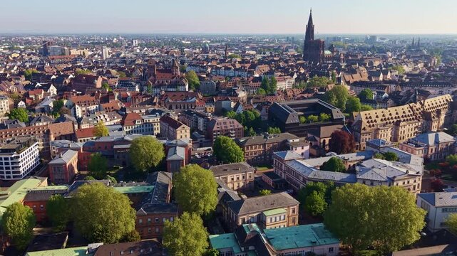 &Eacute;glise Saint-Thomas and Cath&eacute;drale Notre-Dame de Strasbourg dominate the UNESCO Grande &Icirc;le in Strasbourg, Bas-Rhin, Grand Est, Alsace, France, slow drone pullback.