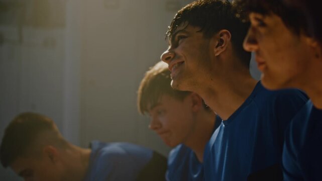 Teenage Football Players in Locker Room After Grueling Training Session or Game. Boys Hair Wet With Sweat But Relaxed, Sharing Lighthearted Conversation and Smiling. Camaraderie and Team Spirit.
