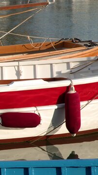 Close Up of Red and White Wooden Boat in Cassis Harbor