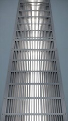Obraz premium Modern Vertical Ventilation Panel with Horizontal Slats and Light Passage