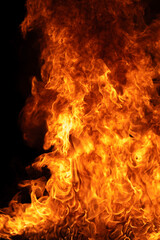 Fototapeta premium Flame surrounds vivid flames. Flame reaches glowing flames. Bright flame with fire. Burning flame near fire.