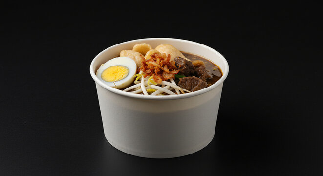 Indonesian Beef Soup with Egg and Sprouts in Paper Bowl