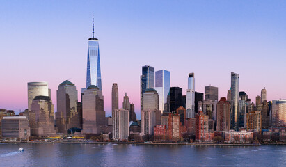 Naklejka premium Manhattan downtown panoramic view in New York City at dusk. Manhattan panorama in New York City. NYC Manhattan skyline panoramic dusk view. Manhattan skyscrapers.