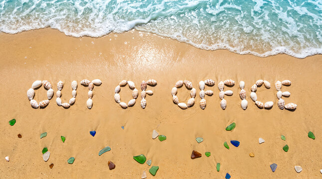 Out of office sign written with speckled sea shells, scattered colorful sea glass pieces on wet sand, ocean wave foam incoming from the top, sunny seashore, lifestyle and conceptual photography