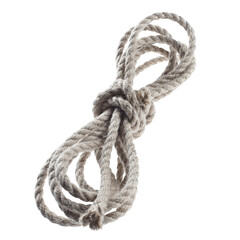 Obraz premium Coiled natural cotton rope tied in the center, isolated on cutout transparent background