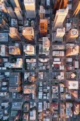 Fototapeta premium View from above showing city skyline at sunset highlighting buildings, streets, and urban layout in a major metropolitan area