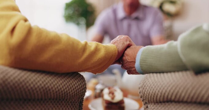 Holding hands, prayer and support with old people in retirement home together for belief or faith. Empathy, praying and religion with senior friends in apartment for bonding, christianity or praise