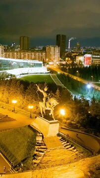 Vertical video. Ufa, Russia. Square named after Salavat Yulaev. Panorama of the city. Night city lights. Drone footage. Rich colors
