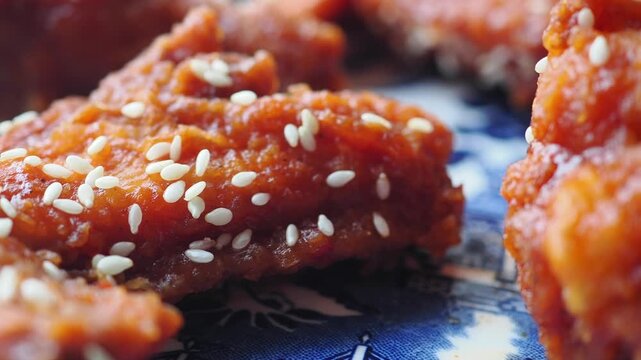 Savoring the crunch of sesame chicken bites at sunset