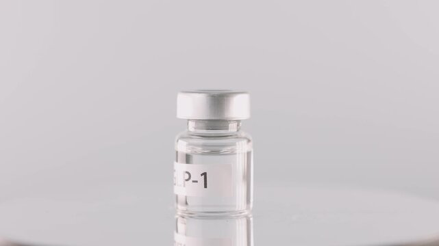 Hopeful clinical glass vial offers medical weight management treatment, representing sterile laboratory injection therapy for healthy obesity medicine solutions