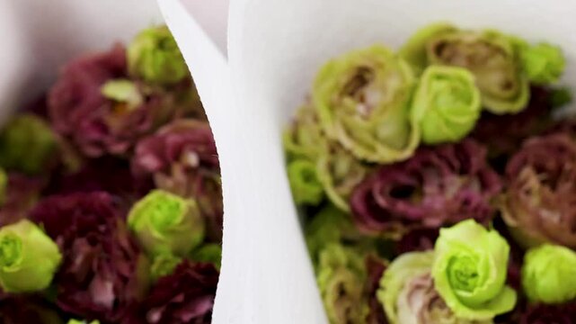 Close Up Pan of Fresh Pink and Green Lisianthus Bouquets