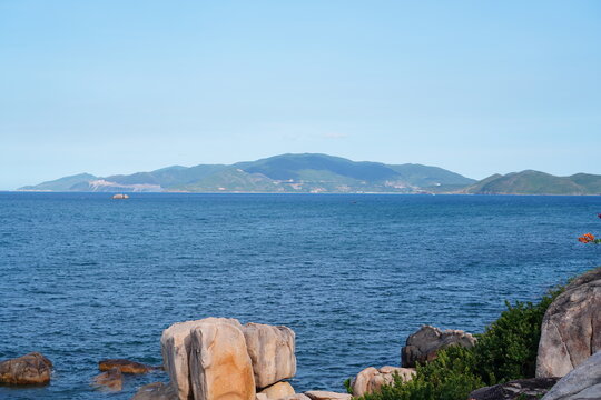 Hon Chong stacked granite rocks overlooking blue bay with islands and mountains, Nha Trang, Vietnam