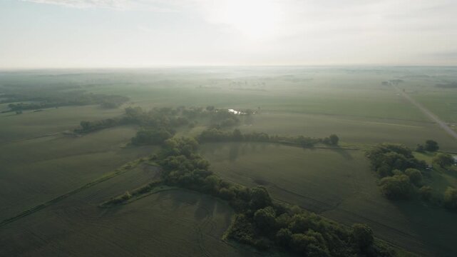 Push in aerial shot of lush rural land
