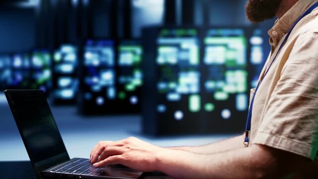 System administrator supports AI computing in a high tech facility, connecting artificial intelligence, machine learning workloads and large scale data processing during server mainframes audit.