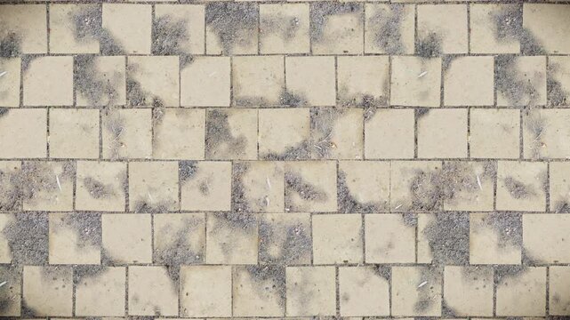 Abstract pattern background of weathered beige square tiles with gritty dark grey dirt and light debris, a seamless loop.