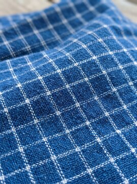 Blue Plaid Woven Fabric Draped in Soft Natural Light