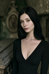 Fototapeta premium vampire woman with long raven hair in black dress, tall athletic female vampire portrait with hazel eyes, elegant gothic vampire with realistic skin and black dress