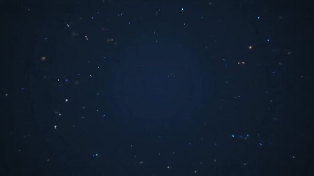 A glowing blue digital mandala pattern on a dark background