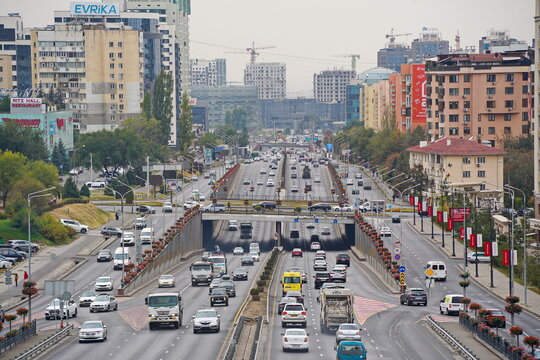 Almaty, Kazakhstan - 09.30.2022 : Traffic flow on one of the central streets of the city. Ecology.  Traffic jams and speed limits.