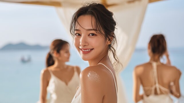 Young woman is using a white cream on her shoulder and her face,Facial care for female,moisturizing cream,healthy skin,Taking good care of her skin,Skin cream concept.