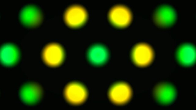 Glowing green and yellow circles pulsing in digital motion footage