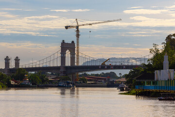 Lawas Suspension Bridge During Construction in Sarawak, Malaysia © Suzeanywati Gasinin
