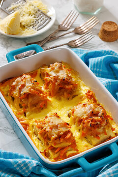 Cheesy Veggie Baked White Fish in blue baking dish