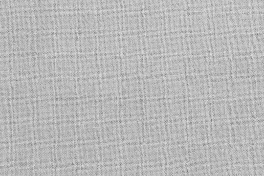 Light grey cotton fabric texture background, seamless pattern of natural textile.