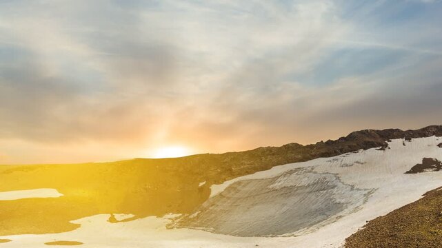 sunset over a spring mountains time lapse scene