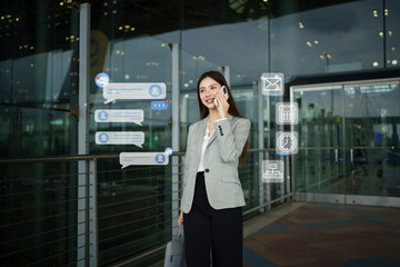 Fototapeta premium Businesswoman Talking on Phone at Airport with Digital Communication Icons and Message Notifications Overlay