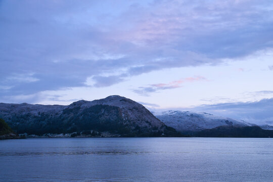 Soft twilight over a Nordic fjord and mountain landscape