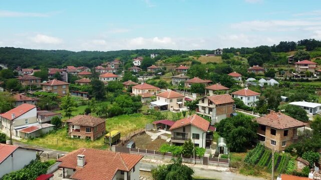 Flying over Yasna Polyana village surrounded by lush forests in Bulgaria