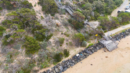 Naklejka premium Aerial View of Wooden Coastal Stairs and Beach at Barwon Heads
