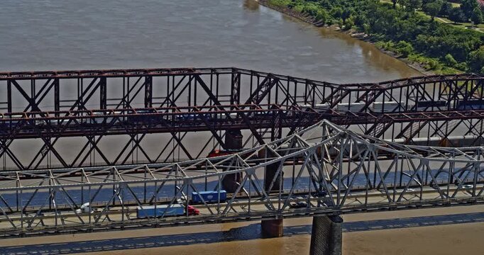 Memphis Tennessee Aerial v27 cinematic orbiting shot of trains running on frisco railroad bridge and vehicles passing on arkansas bridge - Shot with Inspire 2, X7 camera - August 2020
