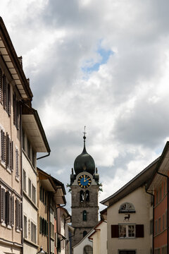 Historic clock tower and traditional buildings in Eglisau, Switzerland