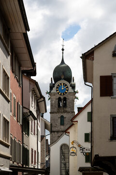 Historic clock tower and traditional buildings in Eglisau, Switzerland