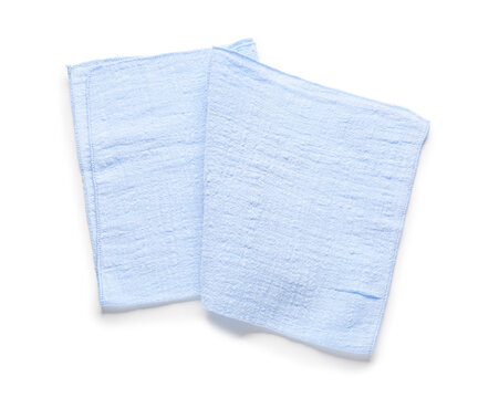 Two light blue muslin cloths or baby burp cloths for hygiene and cleaning, isolated on a white background