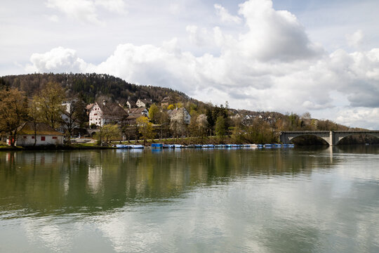 Picturesque riverside village of Eglisau, Switzerland, with historic architecture and boats