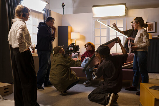 The film crew shoots a video with an actress on set