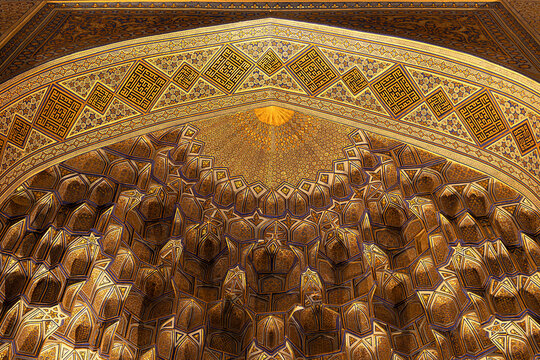 Gilded muqarnas ceiling inside Gur-e-Amir mausoleum in Samarkand, Uzbekistan. Intricate Islamic geometric patterns and calligraphy adorn the dome interior. Ideal for travel, architecture.